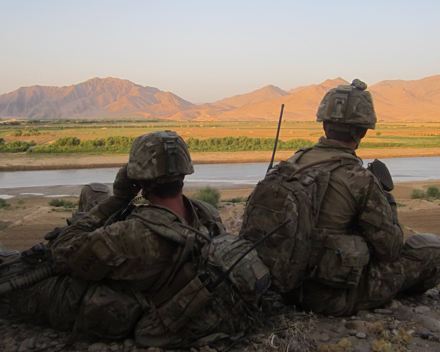 Soldiers overlooking mountain range.